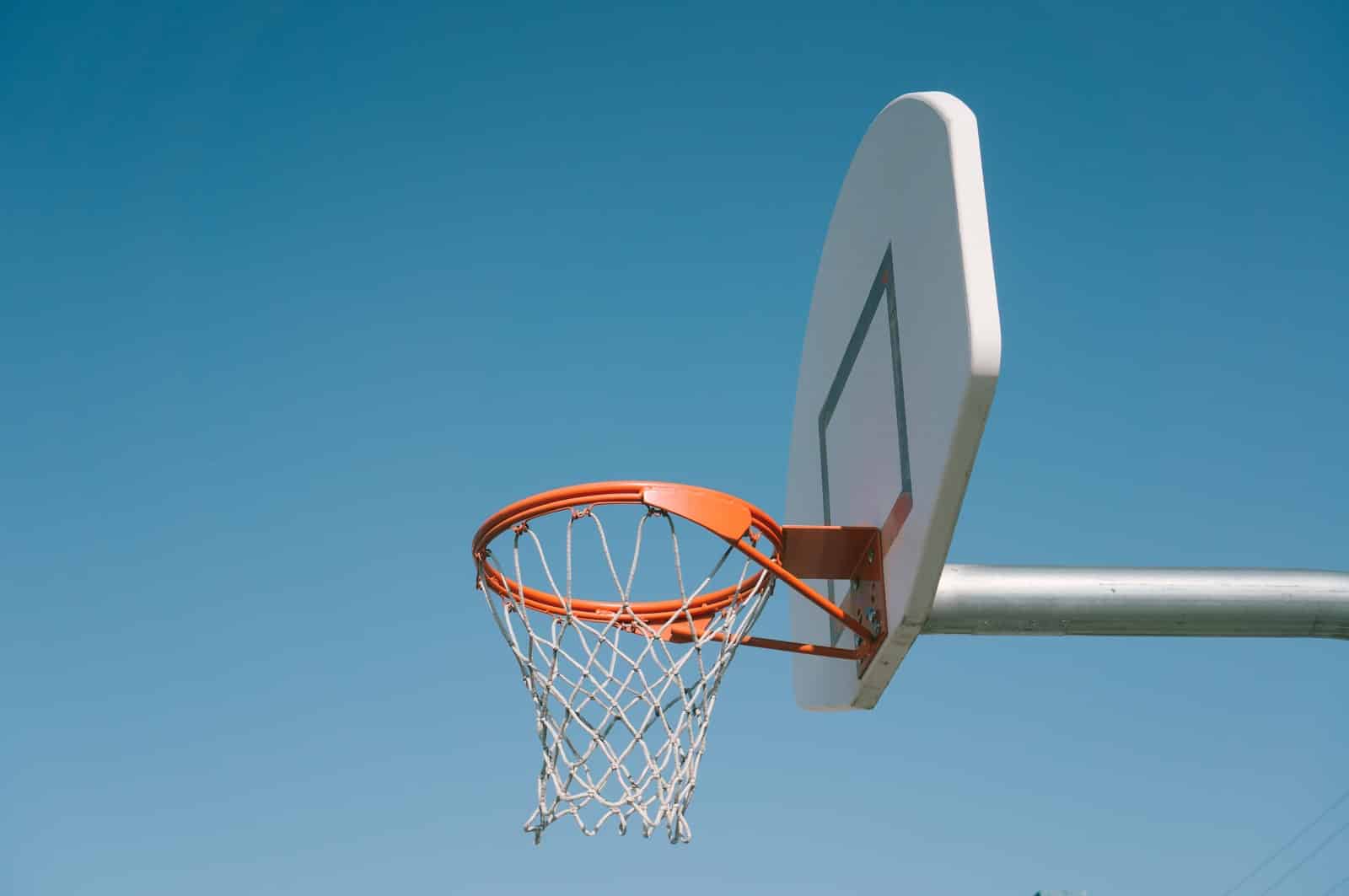 how tall is a basketball hoop?white and orange basketball hoop