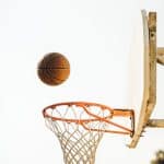 Can you jump on a free throw? basketball on basketball hoop with white background