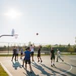 If there is contact between the offense and defense, and the defender is out of position and unable to get in front of the player, it is called a blocking foul. people playing basketball