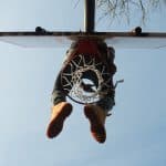 Basketball Rims person sitting on basketball ring