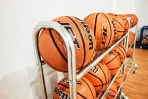 mini & indoor basketball hoopspile of basketballs beside wall