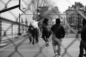 How to Get Better at Basketball in Record Time (31 Ways) grayscale photo of group of men playing street basketball