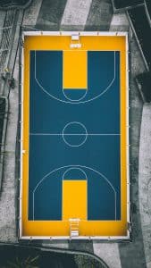 aerial view photography of yellow and blue basketball court
