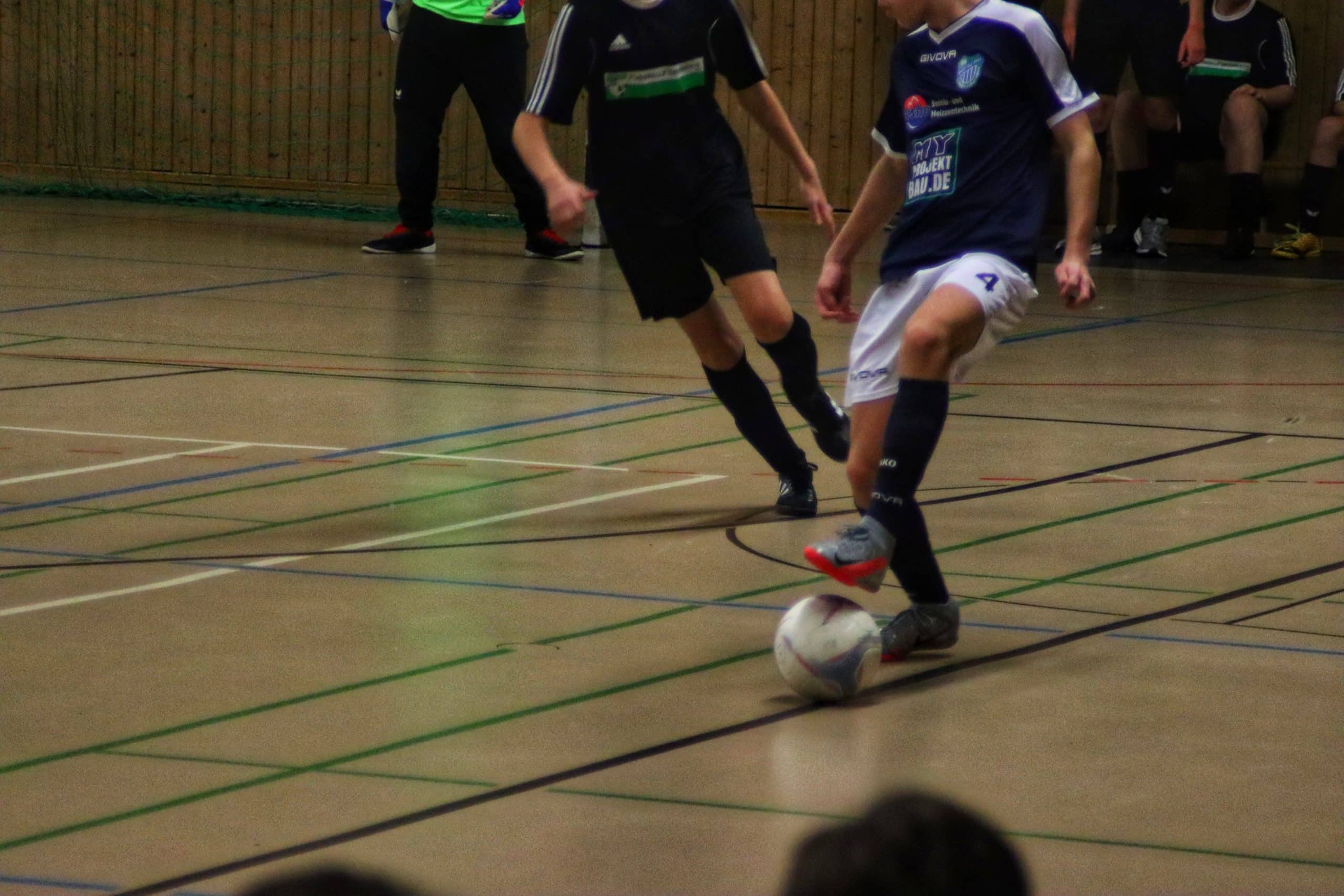 a group of young men playing a game of soccer