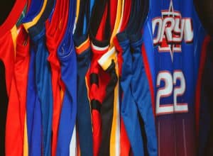 a group of blue and red sports jerseys