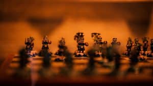 a group of toy figurines sitting on top of a wooden table